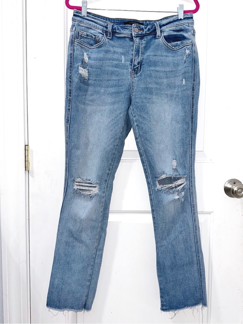 Flying Monkey distressed jeans feature a medium wash, distressed detailing